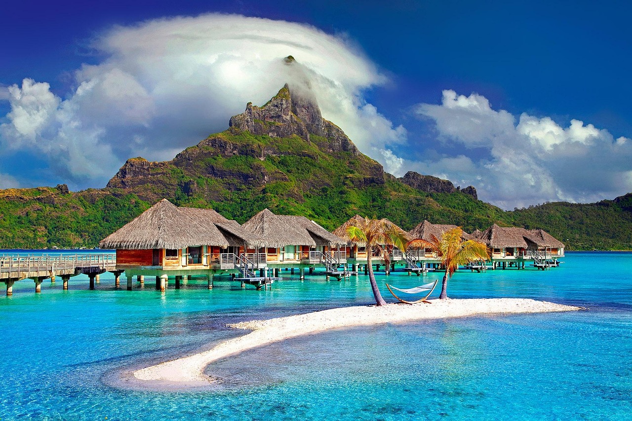 South Pacific cruise featuring turquoise lagoons, tropical islands, and volcanic peaks